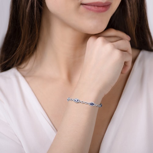 Bransoletka tenisowa SAVICKI: białe złoto, diamenty, tanzanity